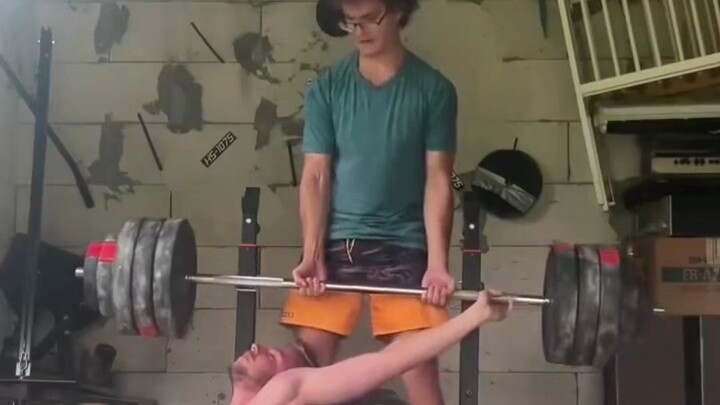 The assistant somehow managed to complete a deadlift.