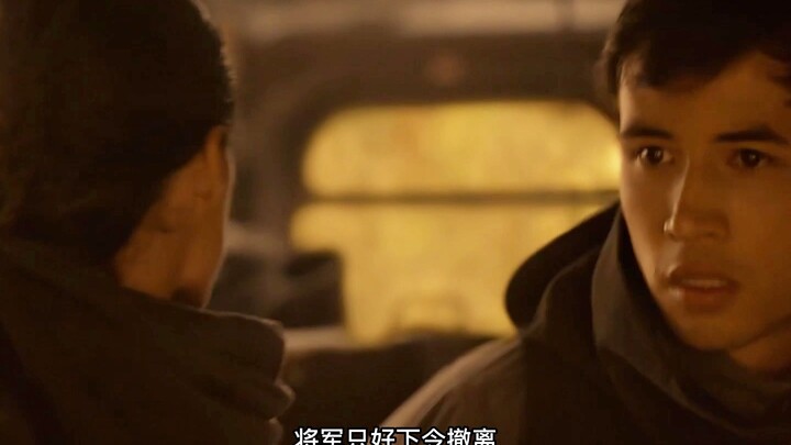 An explosion suddenly rips through the soccer field, freezing everyone in place.