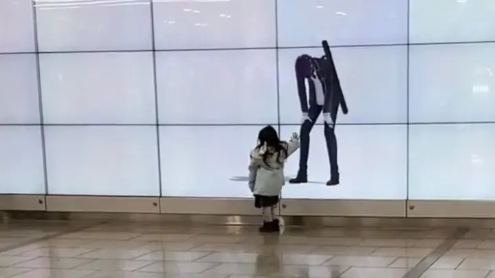 Cute girl interacts with an animated advertisement