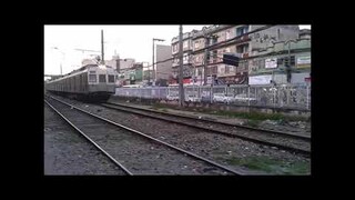 SuperVia local trains in Rio de Janeiro at Santa Marta Level Crossing WITH LOADS OF HORNS AND JAMS