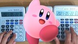 Cover Kirby "Gourmet Race" dengan 3 kalkulator.
