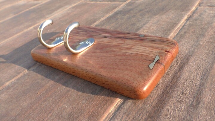 Amir Uzan - 35. Wooden key holder featuring a combination of hooks and magnets