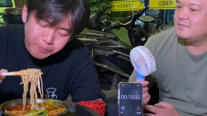 One-take showcase: Handsome guy takes on a 2-liang serving of snail noodles—so far, he’s the fastest