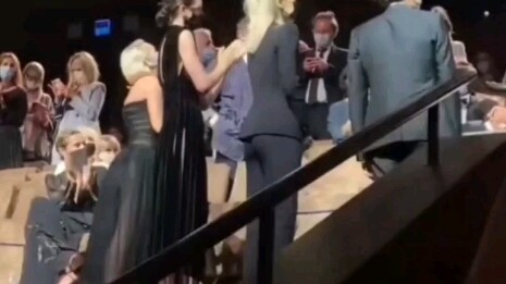 I don't want to be a real person, but they are holding hands.