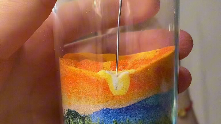 Turning a pile of sand into a stunning masterpiece with a single needle
