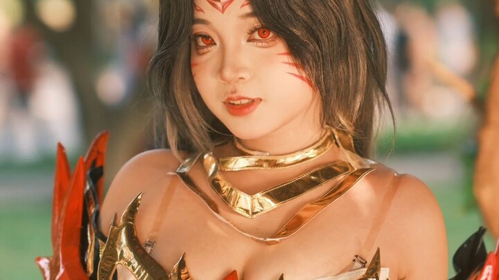 Elegant anime cosplay in a park setting with fantasy costume and vivid colors.