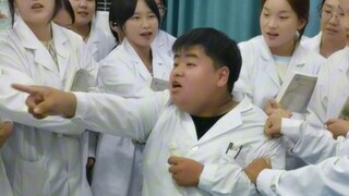 The class monitor, besieged by girls, feels helpless.