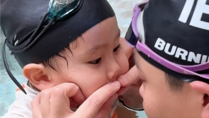 Why are you pinching my mouth while I'm learning to swim?!
