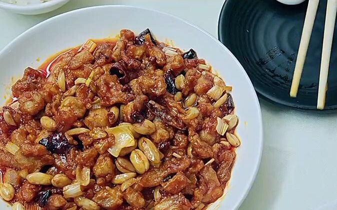 The customer complained that the Kung Pao Chicken didn't taste authentic, so the old man himself too