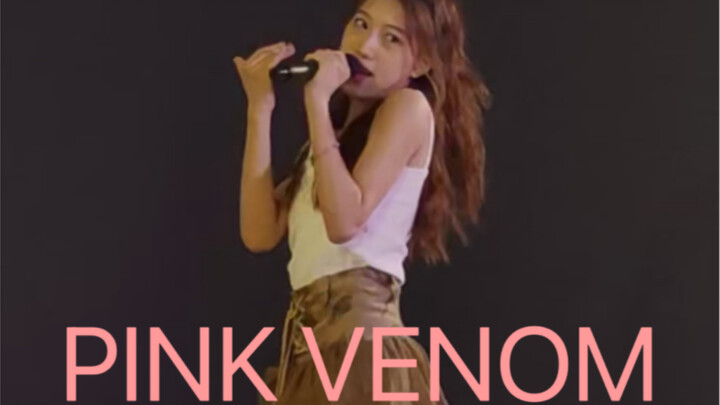 Pink Venom sings and dances with the microphone on (slightly cross-dressed version) The first part i