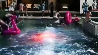 The man ignored his friend's advice and dove into the lava eruption at the bottom of the swimming po