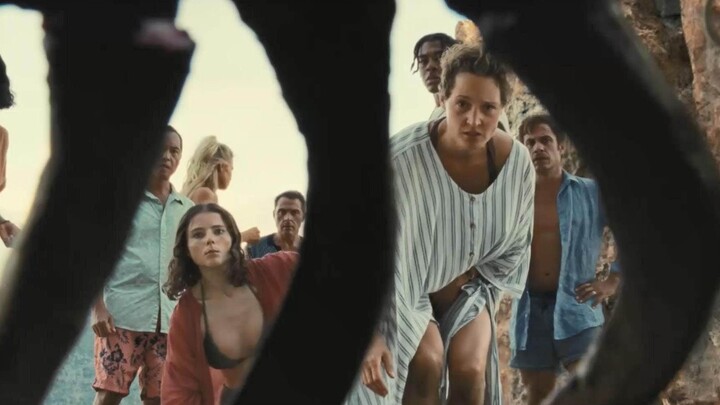 Tourists are trapped on a strange beach where one day is equivalent to 50 years outside, and corpses