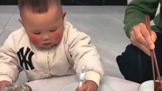 The baby saw his father taking away his meat, so he gave his meat to his mother. At an age when he c