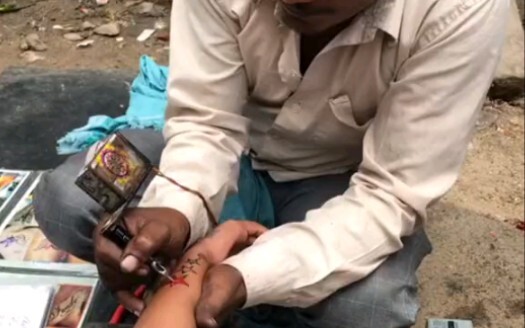 Tattoo stall on the streets of India—I'm thinking about whether I should get one.