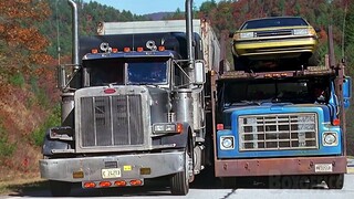 The road is too narrow for these two trucks!