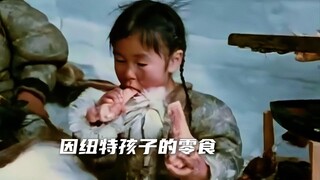 In the Arctic at minus 60 degrees, Inuit children snack on reindeer bones.