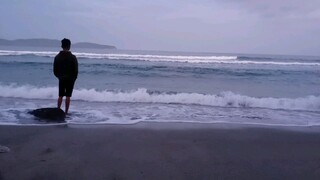 watch a random dude in the waves chilling