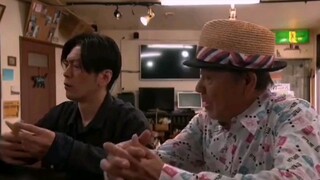 Ultraman Seven gives Ryuki a monthly salary for saving the world and laments that money is hard to e