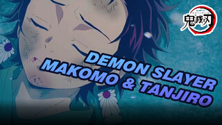 Demon Slayer|Makomo coaches Tanjiro, who finally succeeds in splitting the rock.