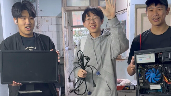 A 10-year-old boy happily gets an 11-year-old complete PC (with monitor)