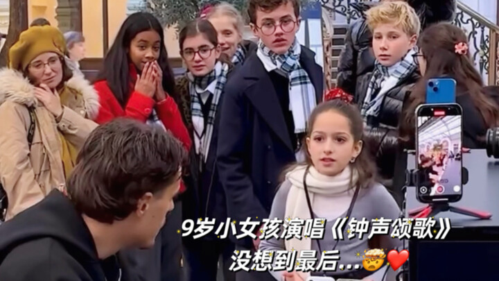 9-year-old girl sings “Carol of the Bells” on a Paris street, but the real highlight is yet to come…