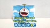Hướng dẫn cách dùng giấy vụn làm Doraemon.