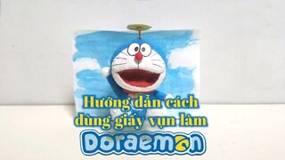 Hướng dẫn cách dùng giấy vụn làm Doraemon.