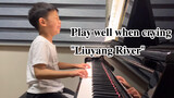 The little boy was crying while playing the piano