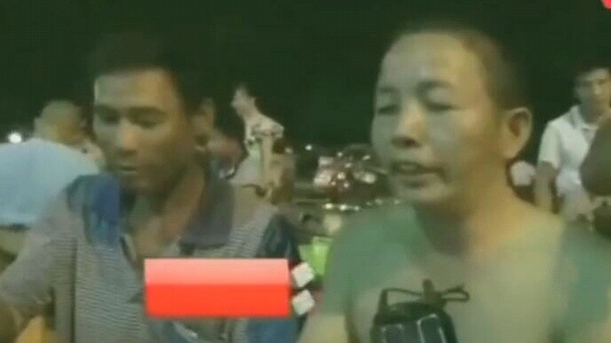 Dog lovers stop tourists from eating dog meat at the Dog Meat Festival, but are mocked by tourists