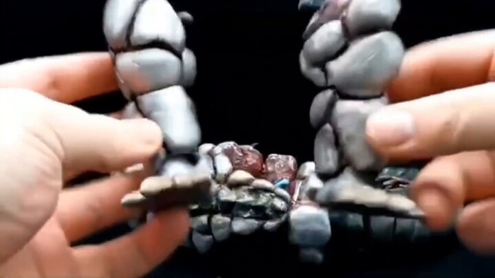 A self-modified Ultraman Tiga Silver Dragon Silbagon, a little fat dragon made of putty that comes w