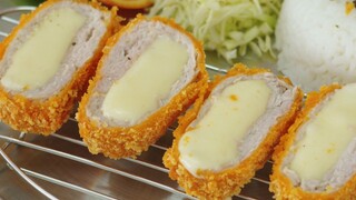 Calorie bomb! Loaded with cheese, this juicy pork chop is bursting with flavor!