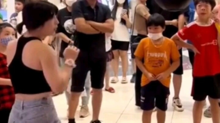 This boxing girl packs some serious punch—little onlookers are so shocked their chins almost drop!