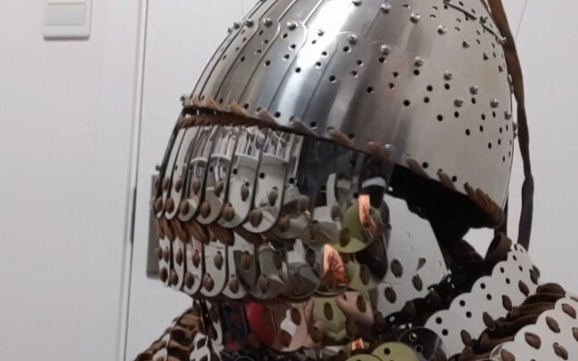 Chest X-ray, armor plates, braided helmet, glasses—movement demonstration without attached arm guard