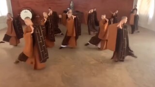 Dancing monks at the Merced Temple