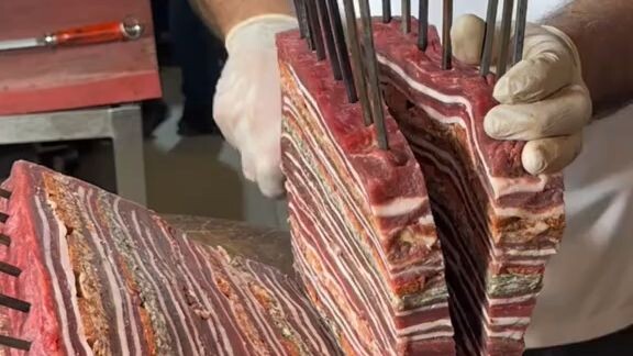 So this is how they prep for Turkish kebabs—layers of meat stacked one on top of another, then slice