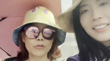 A mother from Taiwan asks about the slogans painted on the wall. How does her daughter, who has live