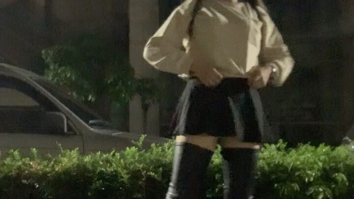 Cross-dressing queen wears thigh-high boots and hits the streets late at night.