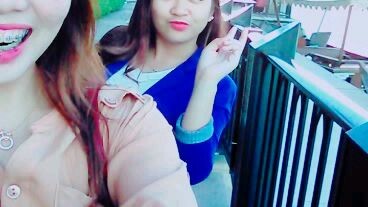 my sister roll the camera and beside her friend and sign of peace