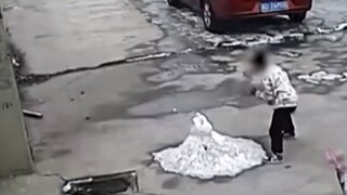 Three boys kicked apart a snowman by the roadside, then rode their bikes to catch it and make it reb