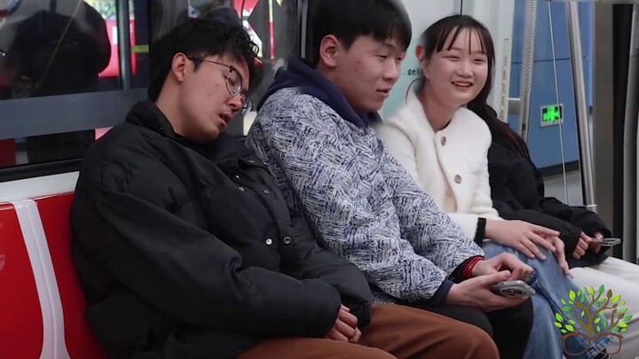 When a loud snoring sound suddenly came from the subway, the girls had a hard time holding back thei