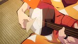 Zenitsu playing a guitar