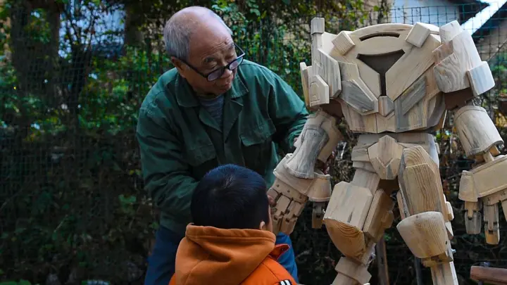 Old carpenter carves a robot from wood, with functional parts!