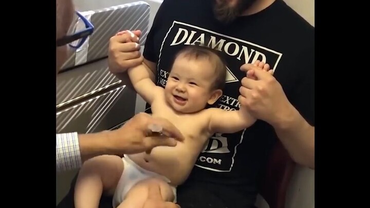 The doctor uses cheerful music to distract the baby, then pulls off a masterful move in an instant o