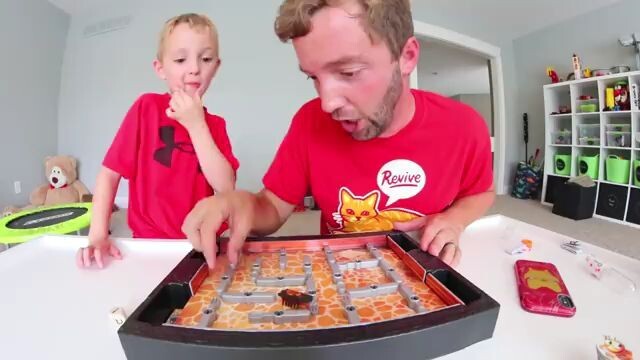 father son play bugs in the kitchen