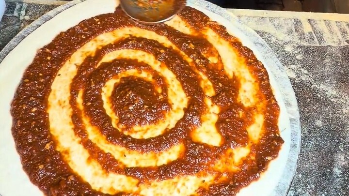 Luxury, extra-large pizza with tons of toppings, priced at 500 rupees.