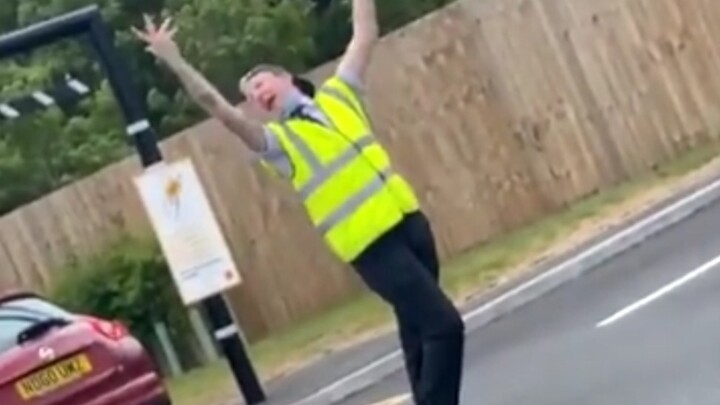 A McDonald's employee dances to "Rain On Me" by Lao Bie and Ariana Grande in the parking lot to attr