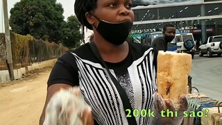 Cuộc sống châu Phi__ Chị bán bánh mỳ kẹp nuôi cả gia đình ở thủ đô Luanda của Angola