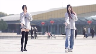 Wow! It looks like there are twins dancing in the square!