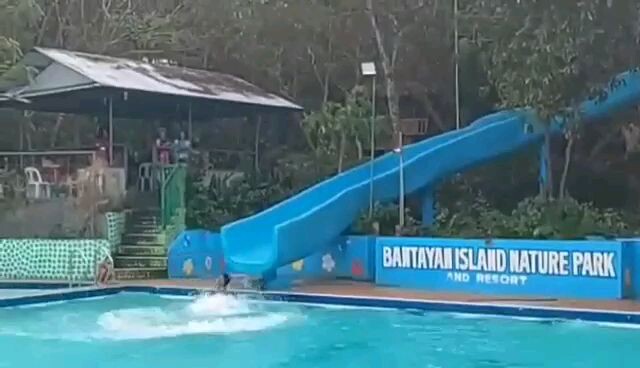 swimming slide in high pool