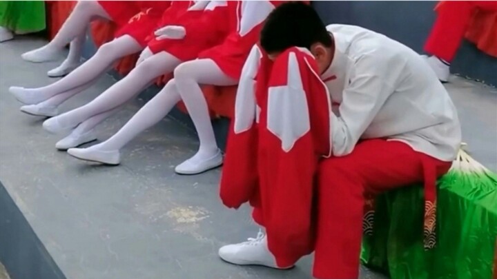 What’s wrong with this guy? Why is he covering his head?